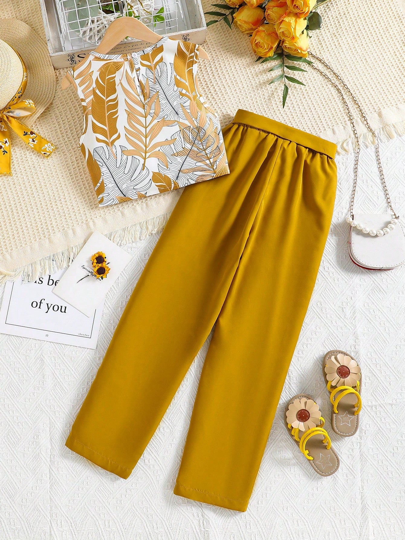 Girls two piece outfit with tropical leaf print sleeveless top and mustard yellow Pant Set