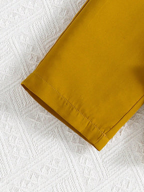 Girls two piece outfit with tropical leaf print sleeveless top and mustard yellow Pant Set