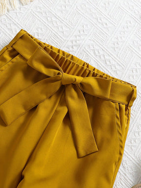 Girls two piece outfit with tropical leaf print sleeveless top and mustard yellow Pant Set